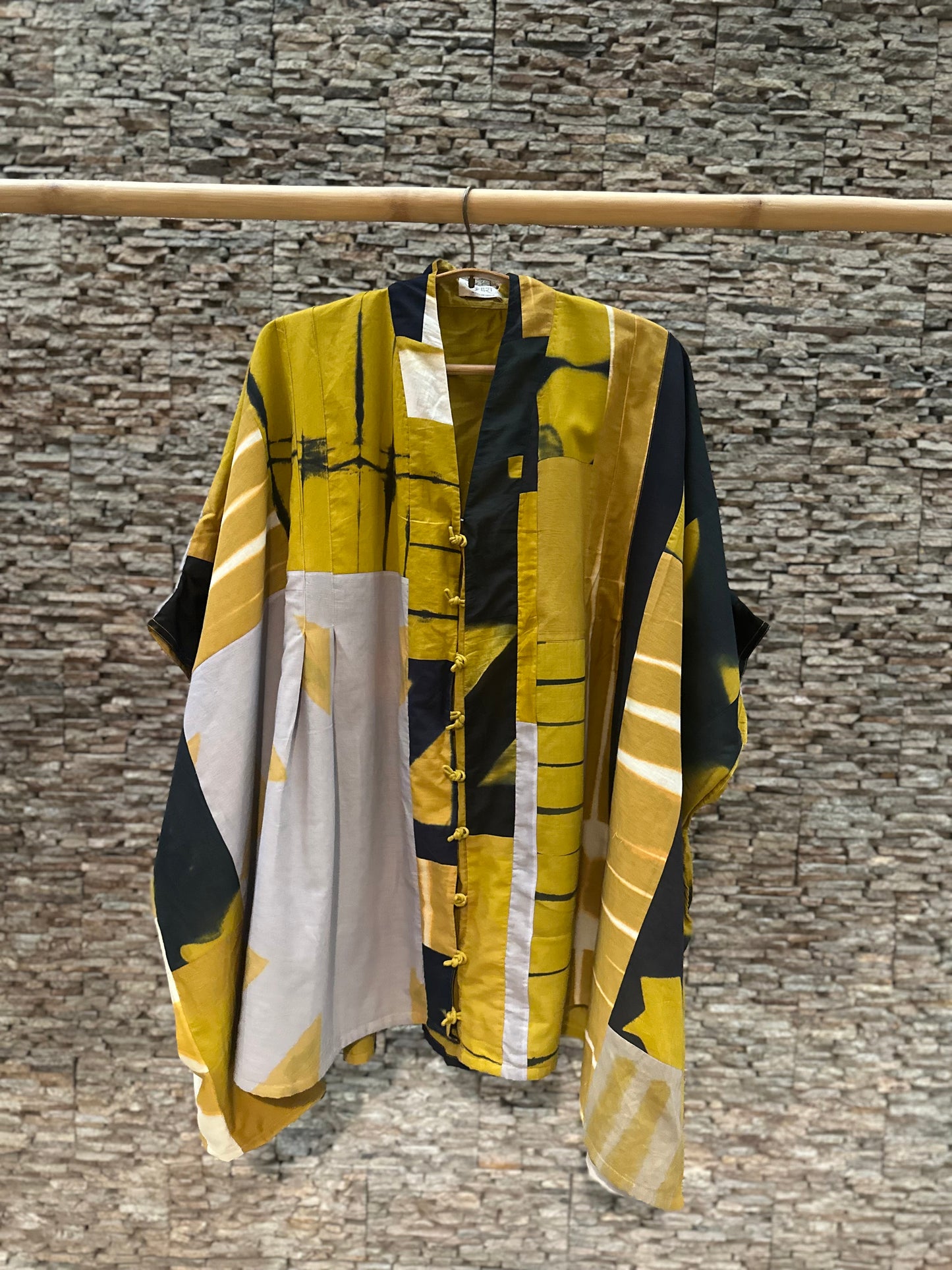 Patched mustard tunic